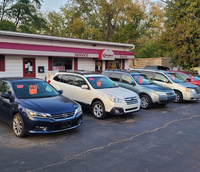 integrity auto store front with row of cars for sale